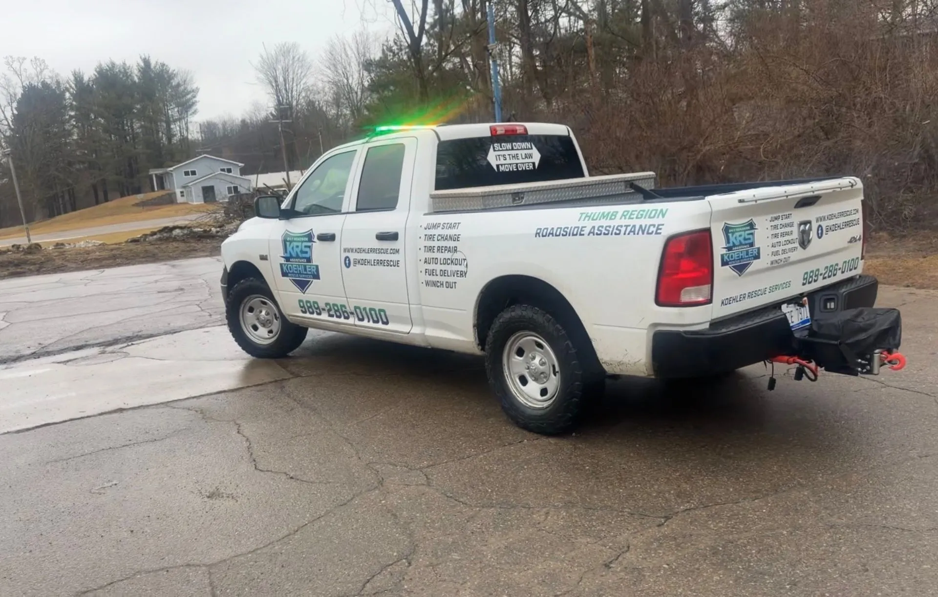 Roadside assistance professional helping a customer