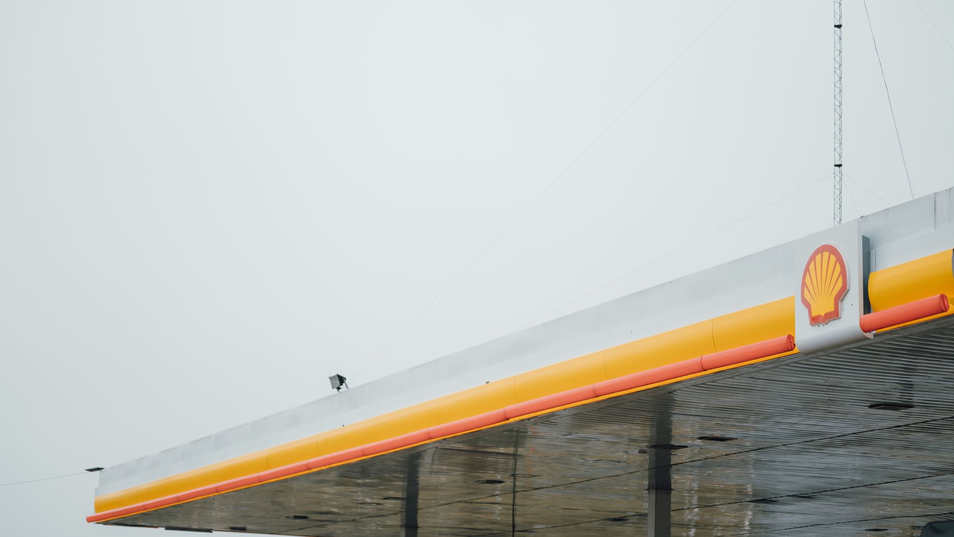 Pouring fuel into a car tank from a gas can