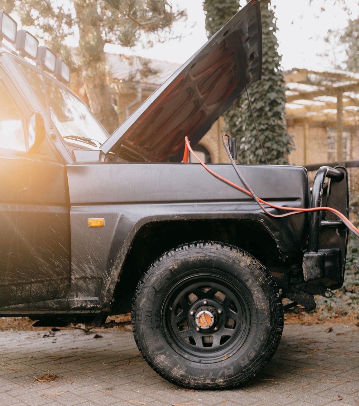 Jumper cables attached to a car battery