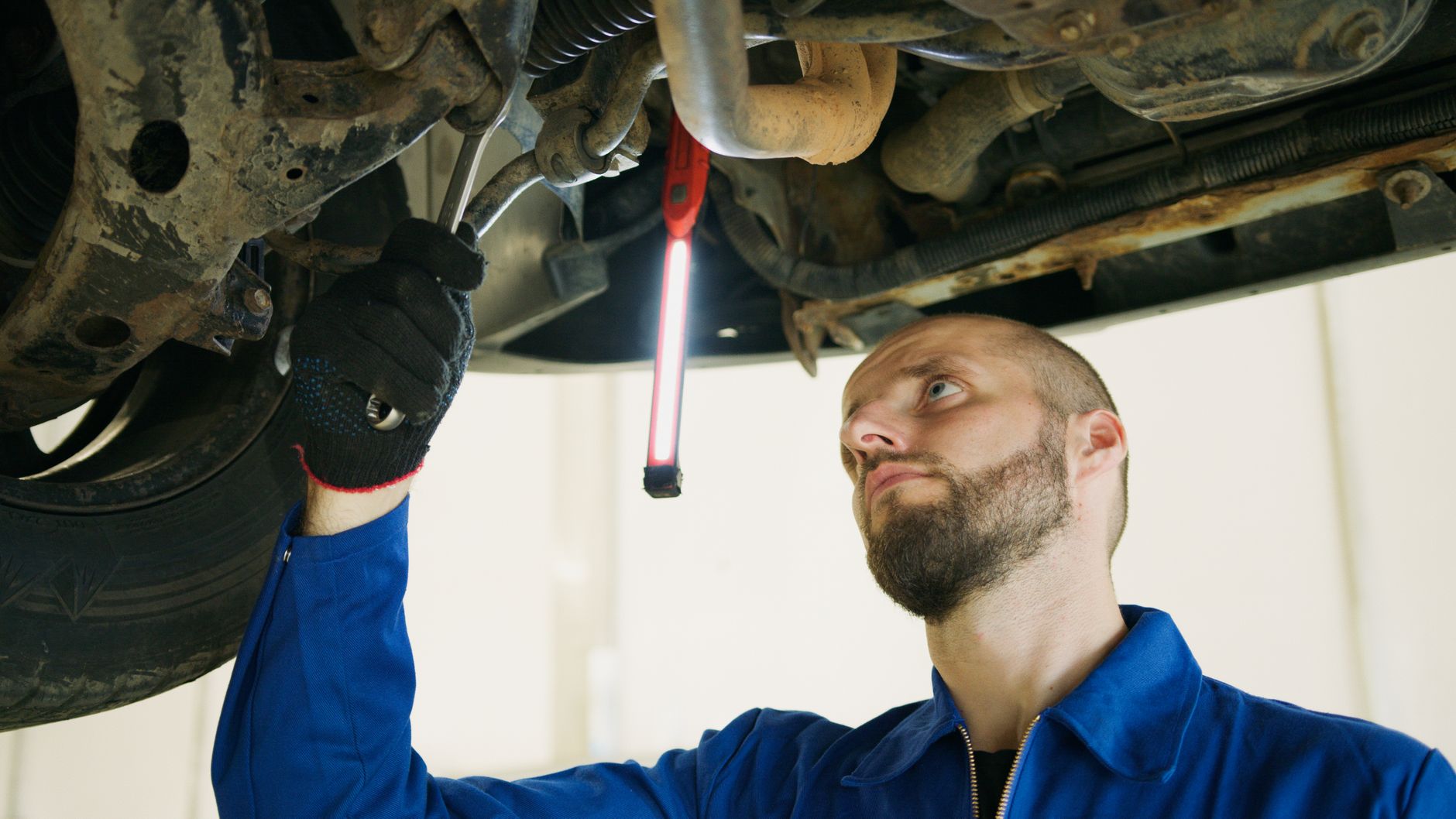 Mechanic focusing on vehicle maintenance