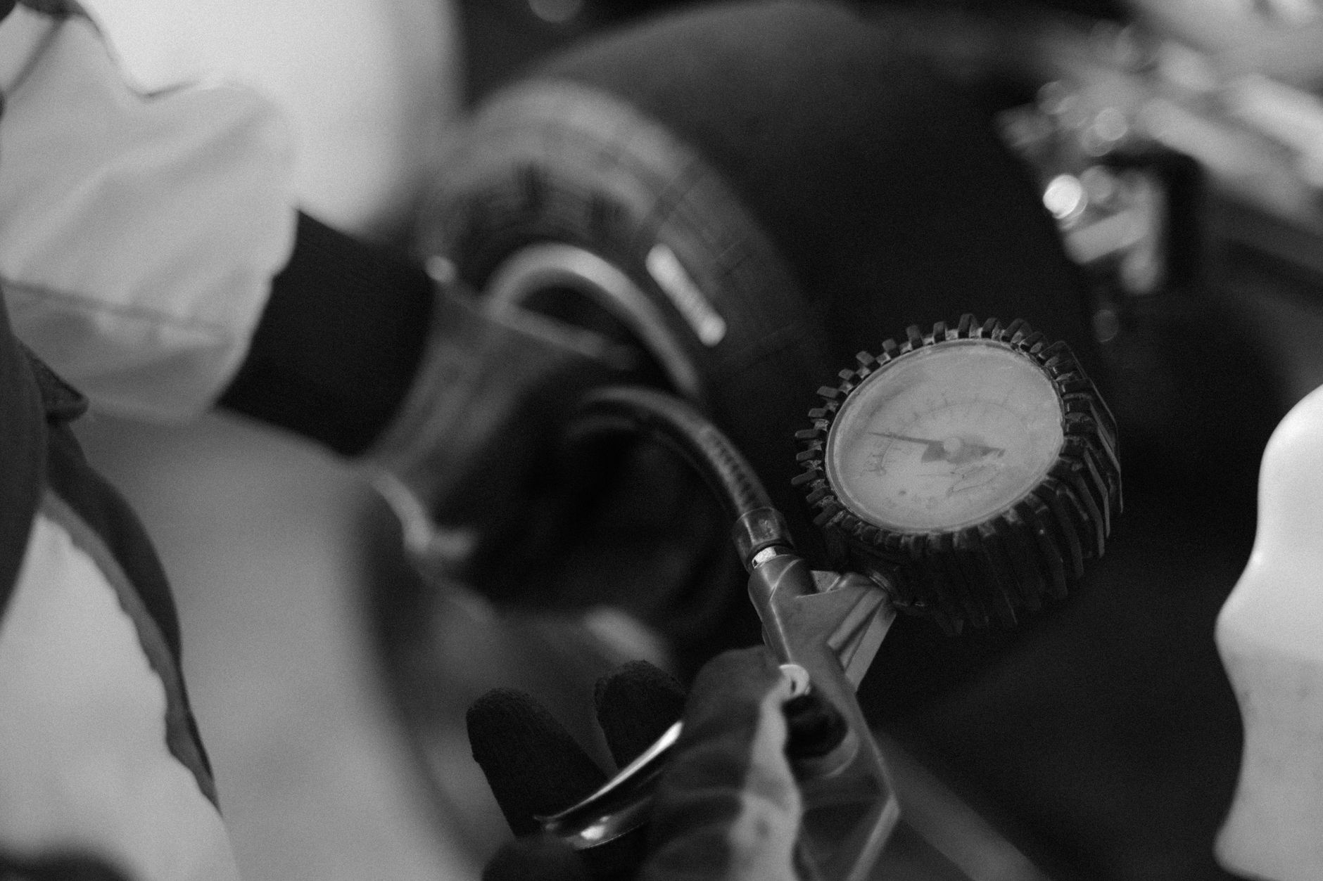 Mechanic checking tire pressure