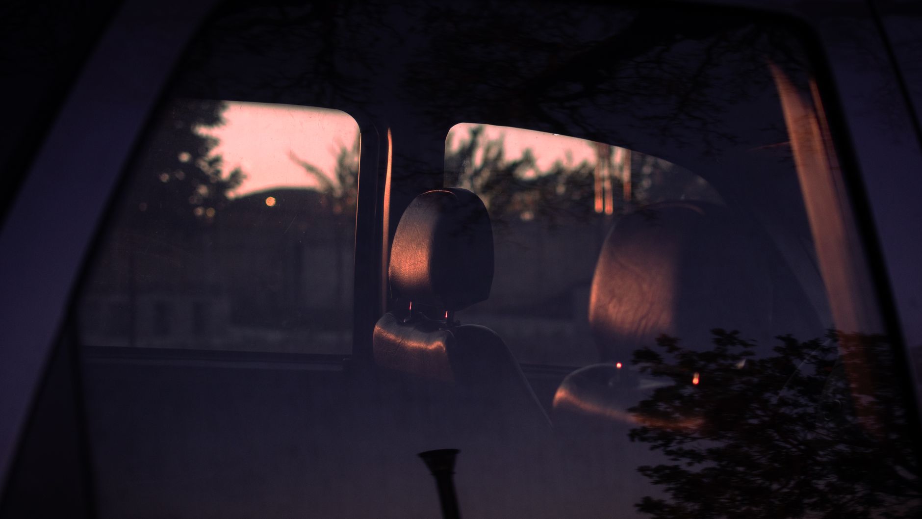 Moody interior car view with reflections and soft lighting at twilight