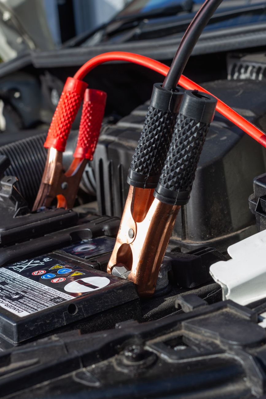 Jumper cables attached to a car battery