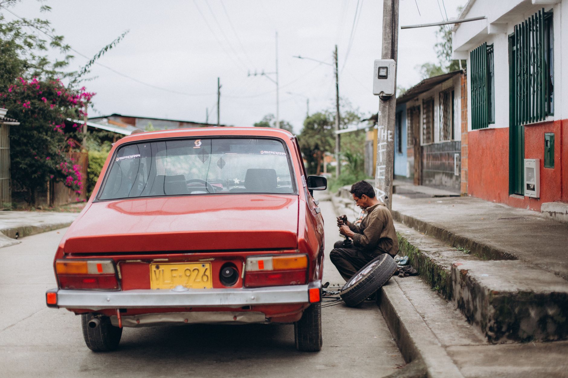 Mechanic repairing a tire on the side of the road