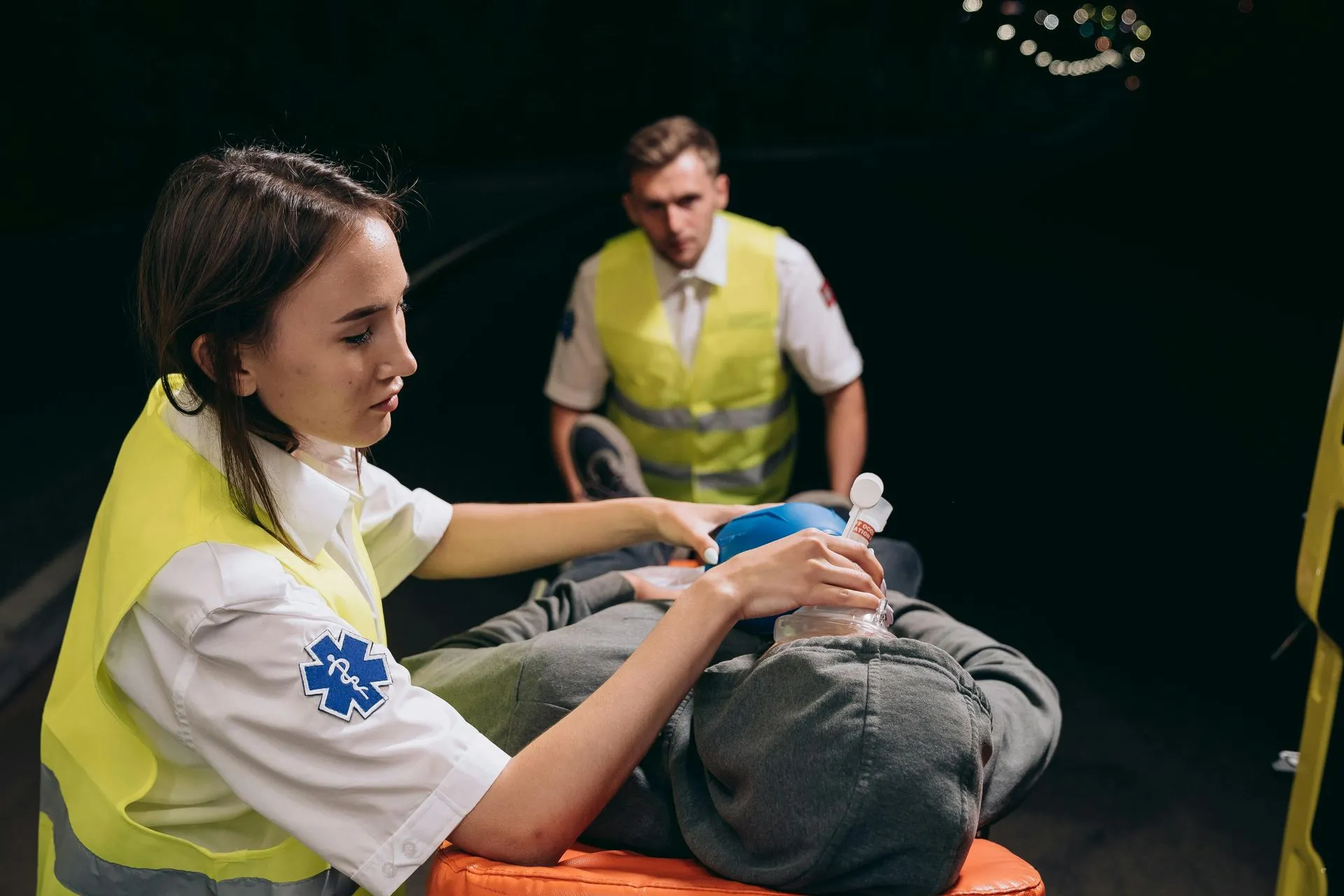 Woman sitting on a stretcher